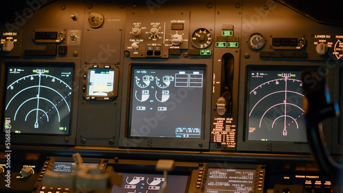 Airplane cockpit with flying command on control panel and dashboard for navigation, engine throttle and radar compass. Plane cabin with windscreen, buttons and handle. Close up.
