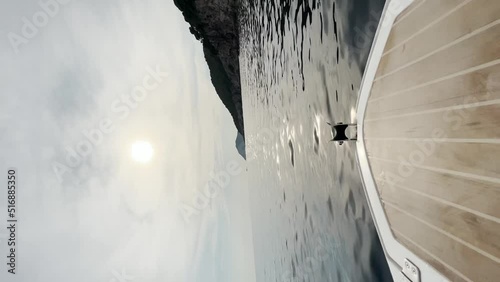 A boat riding through the azure coloured Adriatic sea, Croatia. photo