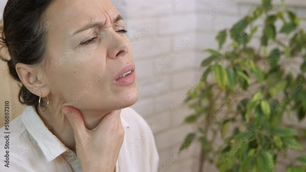 Suffer sore throat in coronavirus quarantine. A view of sick woman suffering from sore throat during coronavirus epidemic. Suffer sore throat in coronavirus quarantine. A view of sick woman suffering from sore throat during coronavirus epidemic.