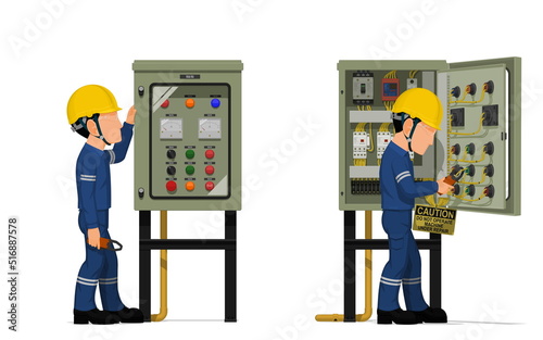 Industrial workers use clamp meter to measuring electric current in the electrical control cabinet