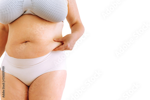 sagging skin with age spots on fat belly, plastic surgery concept