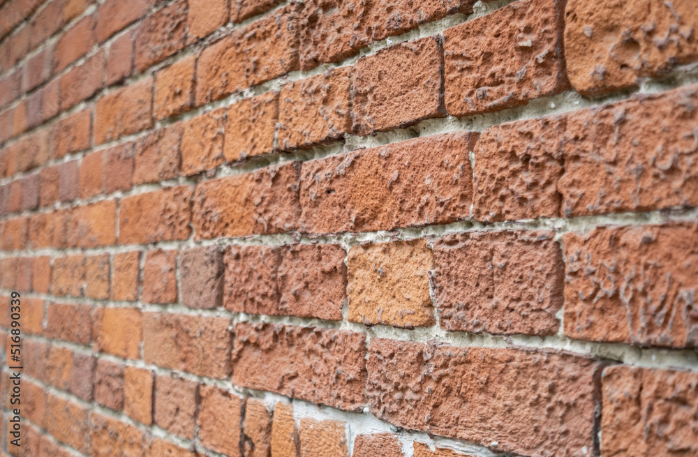Fototapeta premium A red brick wall background side view