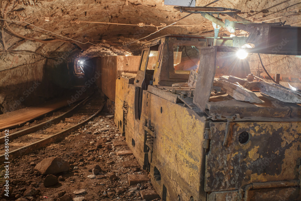 Fototapeta premium Old rusty train in iron ore mine.