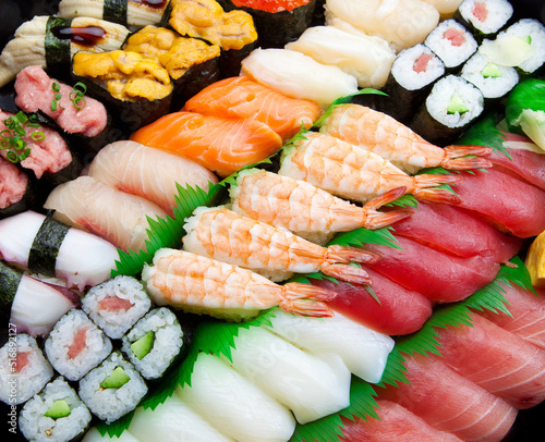 Japanese Sushi arranged on a traditional sushi tray. 