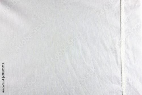 White fabric with a stitched strip.Material cotton white tailoring. High definition white cotton fabric texture.