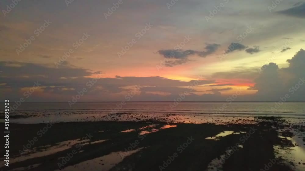 After sunset the sky burns orange yellow.
Breathtaking aerial view flight fly forward drone footage of Gili T beach bali Indonesia at sunset summer. Cinematic view from above by Philipp Marnitz After sunset the sky burns orange yellow.
Breathtaking aerial view flight fly forward drone footage of Gili T beach bali Indonesia at sunset summer. Cinematic view from above by Philipp Marnitz