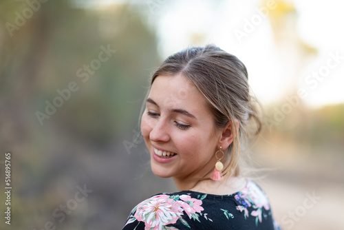 young woman with head turned looking down