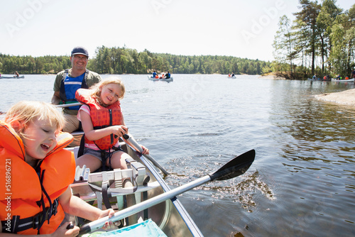Fotografie, Obraz Family of three in rowboat