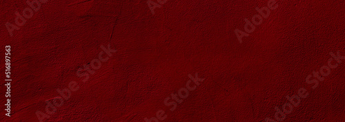 Crimson red colored wide panorama wall background with textures of different shades of crimson red photo