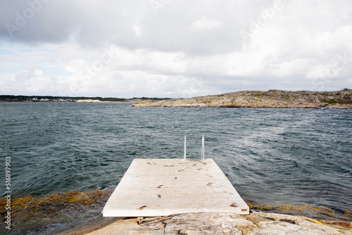 Jetty on sea with footsteeps  photo