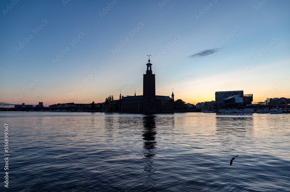 Silhouette of buildings by sea at sunset in Stockholm Sweden Silhouette of buildings by sea at sunset in Stockholm Sweden