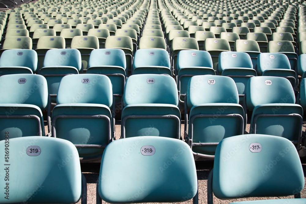 Fototapeta premium Empty Plastic Chairs at the Stadium