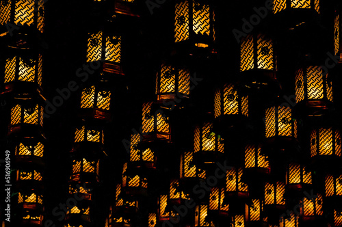 Many lanterns hung on the ceiling of Daishoin in Miyajima, Hiroshima, Japan photo