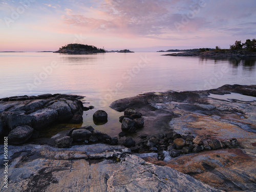 Coastline of lake at sunset photo