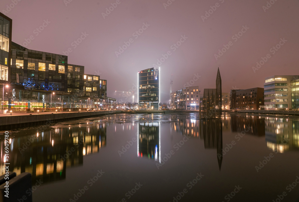Illuminated buildings by canal at night in Gothenburg Sweden Illuminated buildings by canal at night in Gothenburg Sweden
