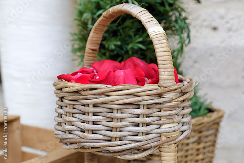 Wicker basket full of rose petals