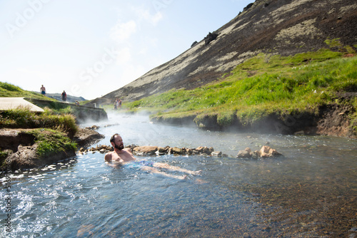Mature man bathing in hot spring