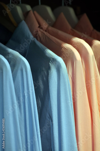 Men`s shirts in clothing store.