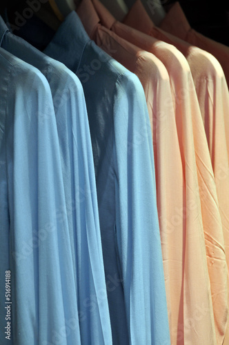 Men`s shirts in clothing store.