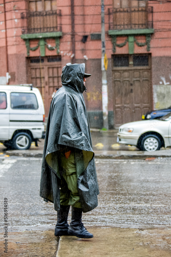 Policeman in raincoat on the streets of La paz, Bolivia.