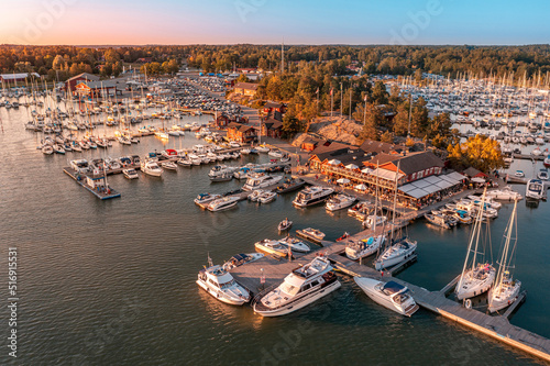 Boats in marina at sunset photo