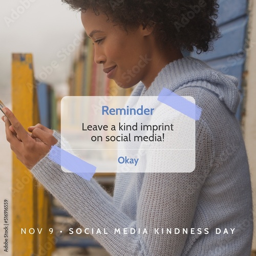 Digital composite image of african american young woman using smart phone with reminder message