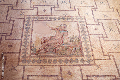 Ancient Greek floor mosaic in archaeologic park Kato Paphos, Cyprus.