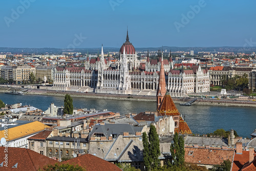 Budapest, Hungary. View on the Hungarian Parliament Building from Castle Hill. Dome and tower of Calvinist Church are visible in the foreground.