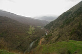 Gorge in the Caucasus Mountains, covered with low clouds.