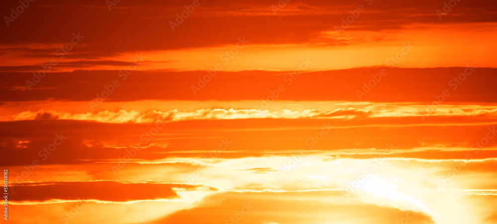 Clouds and orange sunset. Worsening weather conditions. Emergency. Abstract natural background.