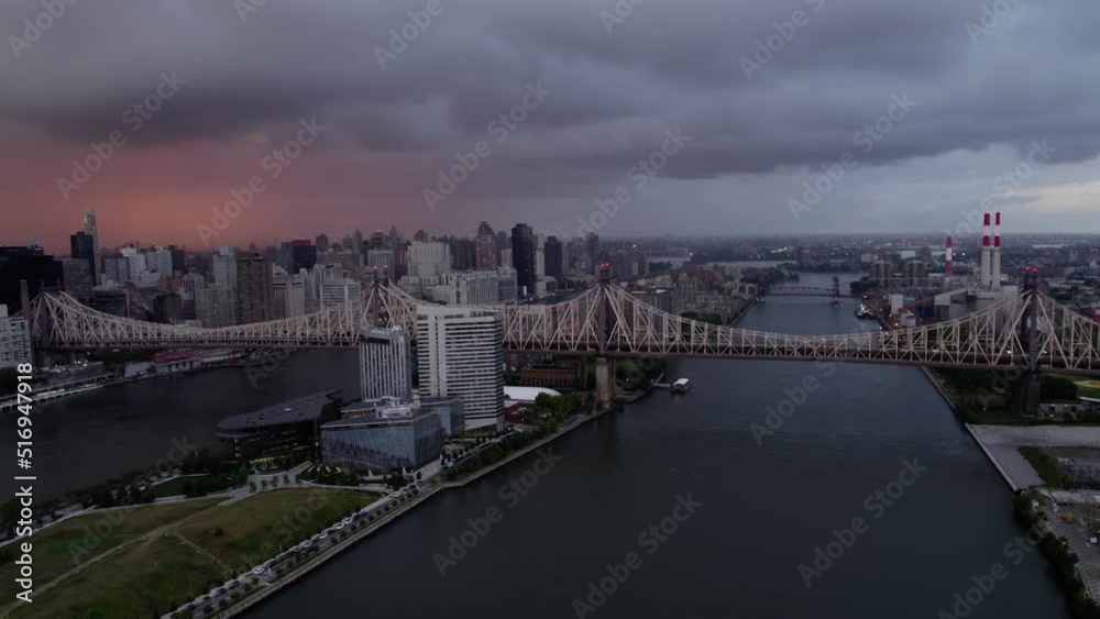 Queensboro Bridge, Roosevelt Island, East river and the Midtown cityscape, gloomy evening in New York, USA - panoramic Aerial Queensboro Bridge, Roosevelt Island, East river and the Midtown cityscape, gloomy evening in New York, USA - panoramic Aerial