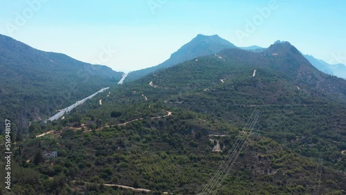 Cars travelling on highway that winds through the mountains towards Nicosia Cyprus photo