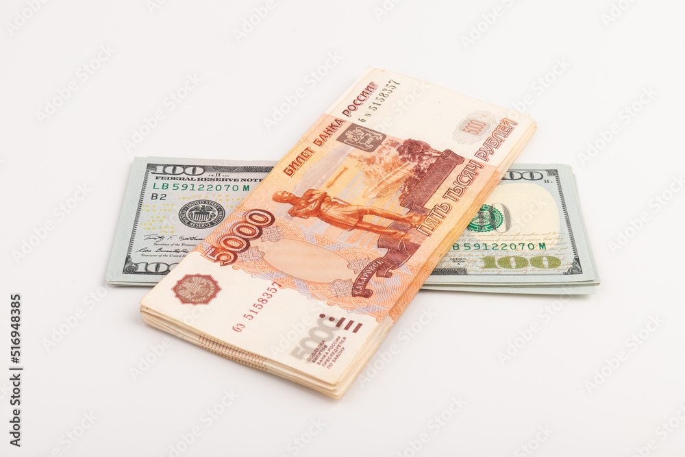 US Dollar and Russian ruble. Money background. Currency exhange. Economic crisis. Rouble dollar cash. Hundred dollar bill and 5000 rubles. Business and finance. Russia and USA US Dollar and Russian ruble. Money background. Currency exhange. Economic crisis. Rouble dollar cash. Hundred dollar bill and 5000 rubles. Business and finance. Russia and USA