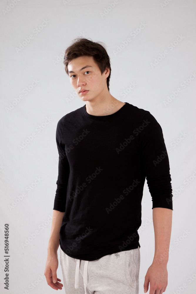 Handsome man in black shirt, looking thoughtful Handsome man in black shirt, looking thoughtful