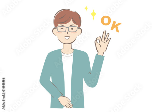 OKサインを出す若い私服の男性
