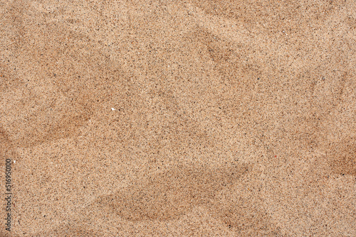 The texture of beautiful coarse sea sand with small pebbles and particles of shells. Yellow sand. sharp sand.