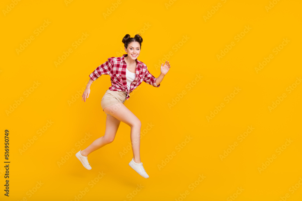 Full body photo of cheerful sportive pretty person rush toothy smile isolated on yellow color background