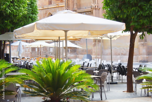 Fototapeta Naklejka Na Ścianę i Meble -  Restaurant area in the surroundings of the cathedral of Murcia, to rest and eat during a tourist visit