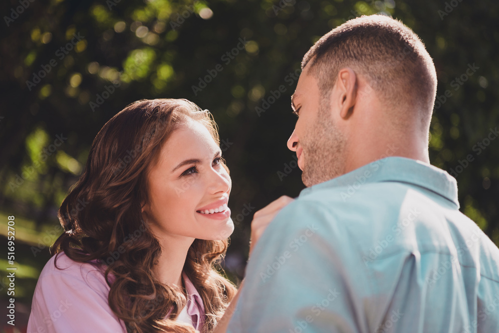 Portrait of two cheerful peaceful partners look each other trust support enjoy nice weather outside Portrait of two cheerful peaceful partners look each other trust support enjoy nice weather outside