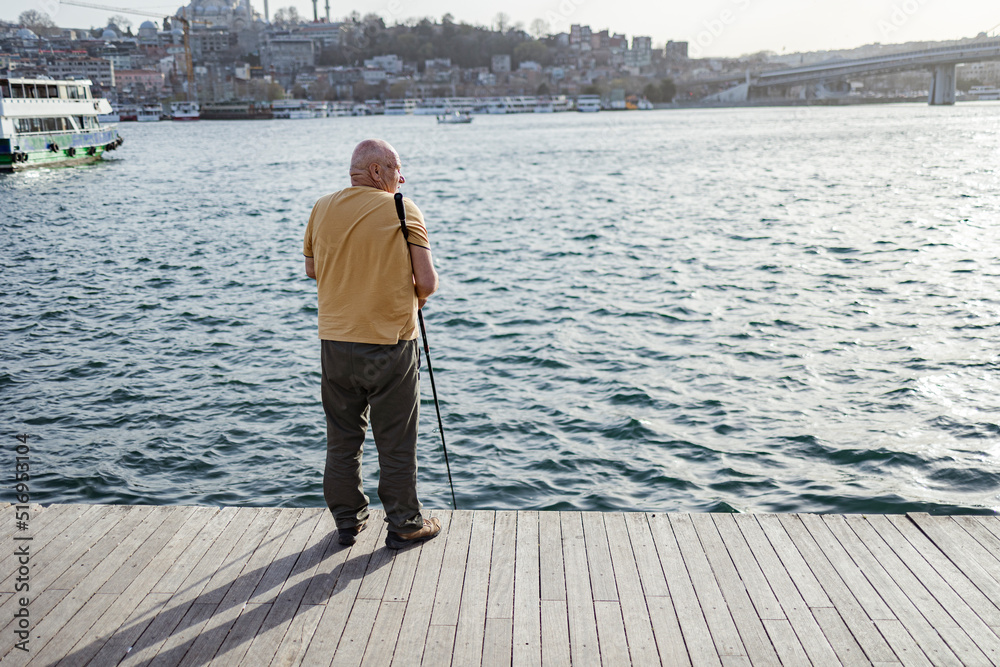Back view of fisherman. İstanbul city view. 