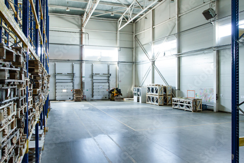 General view to the loading gates inside the warehouse.Interior of a modern warehouse storage. Truck loading process