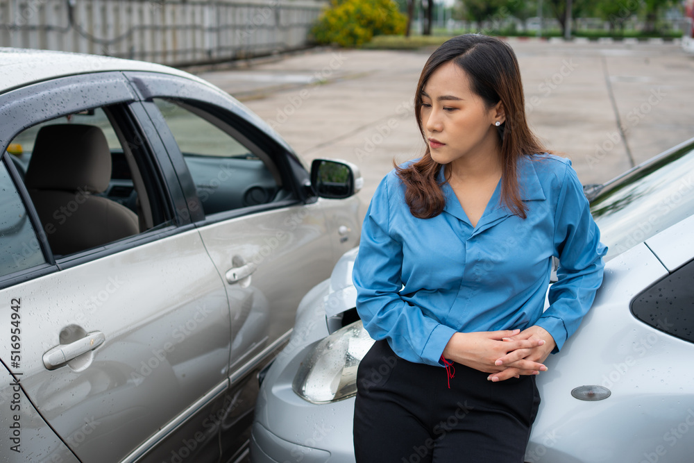 Women drivers sad after a car accident because not have car accident insurance. Women drivers sad after a car accident because not have car accident insurance.