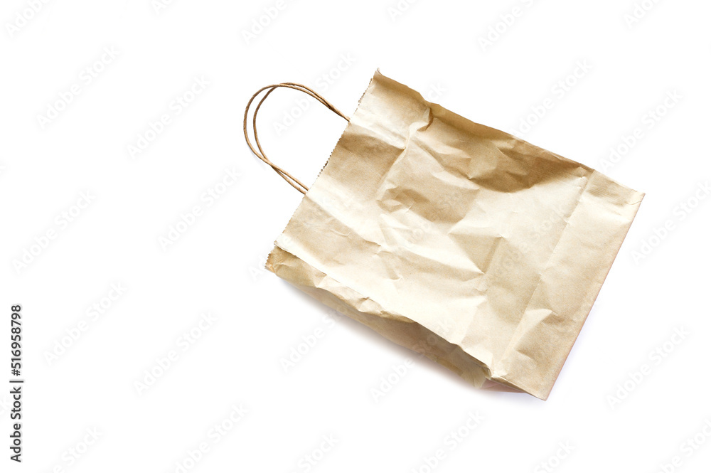 Naklejka premium Brown wrinkled paper bag isolated on white background.