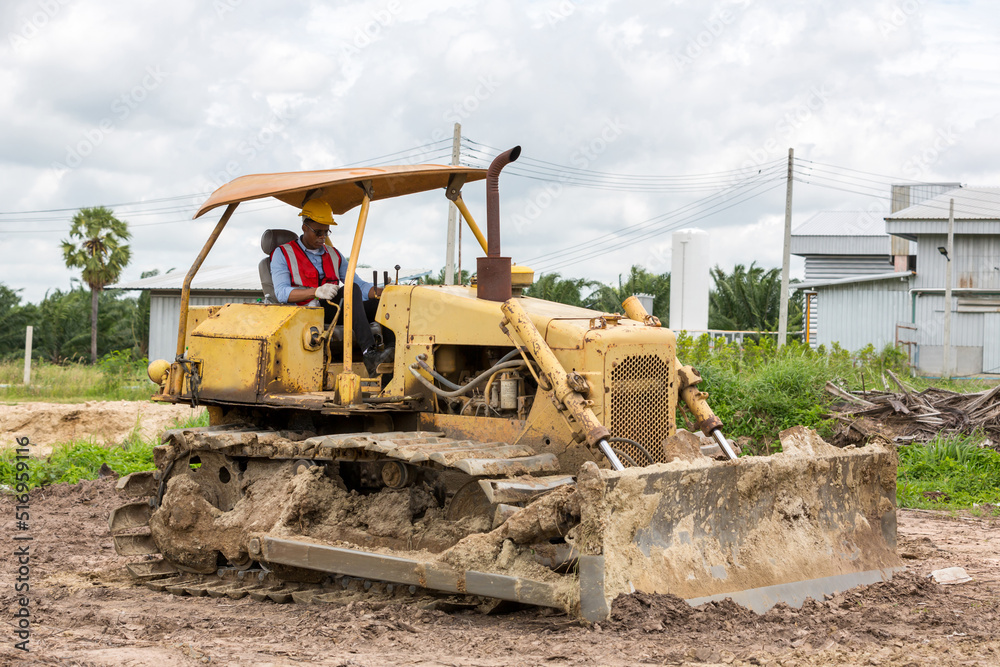 Fototapeta premium Engineer or Worker operator driving excavator on construction building site 