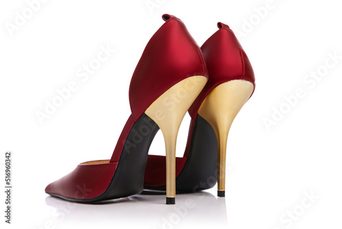 Woman's vintage style footwear. Red high-heeled shoes isolated on white background. Concept of art, ad , 60s, 70s retro style fashion. Timeless classic