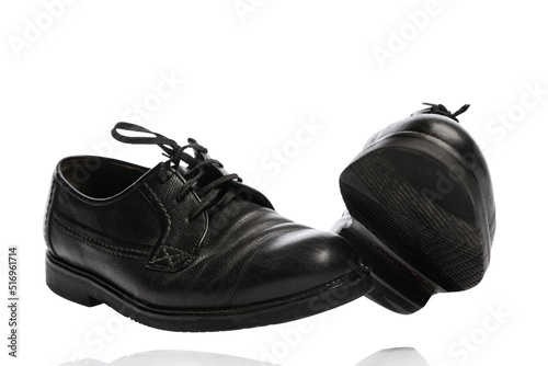 Old black man's shoes isolated over white background. Vintage classic style footwear. Concept of ad, sales , 60s, 70s fashion. Timeless classic