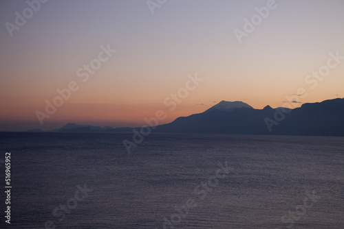 Antalya, Turkey. Mediterranean sea and mountains view from waterfront park at sunset.