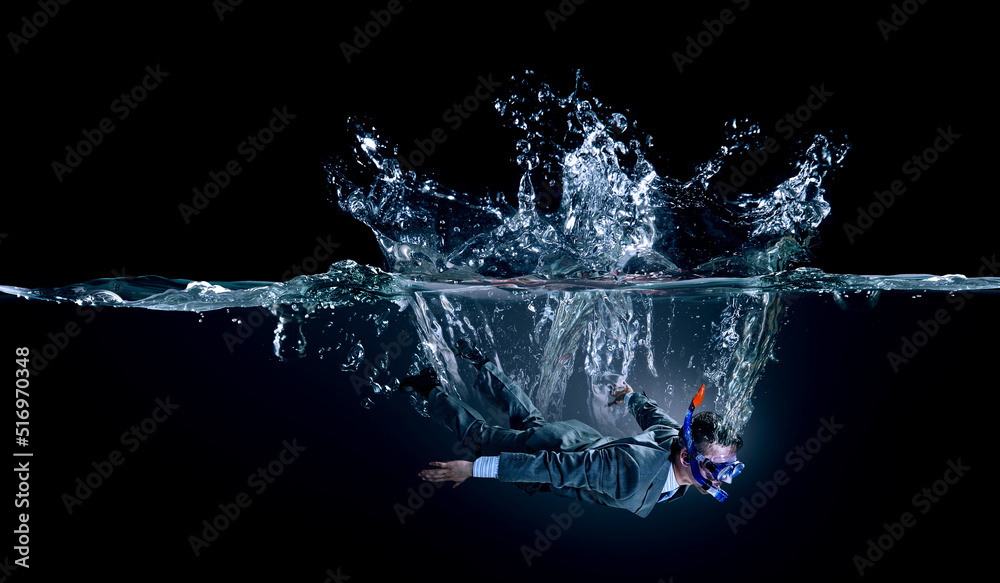 Funny businessman swimming underwater . Mixed media - obrazy, fototapety, plakaty 