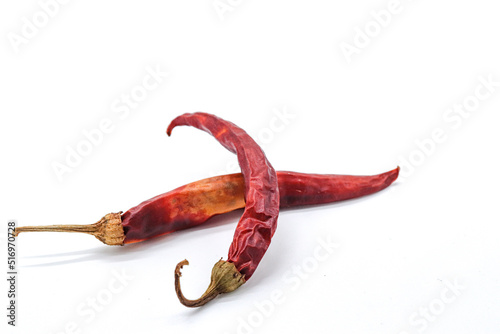 dried red chillies on white background