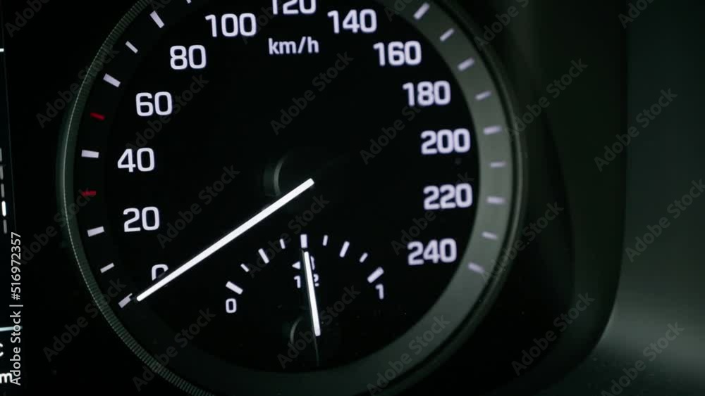Close-up of a tachometer and fuel gauge in a car. The instrument panel lights up. Close-up of a tachometer and fuel gauge in a car. The instrument panel lights up.